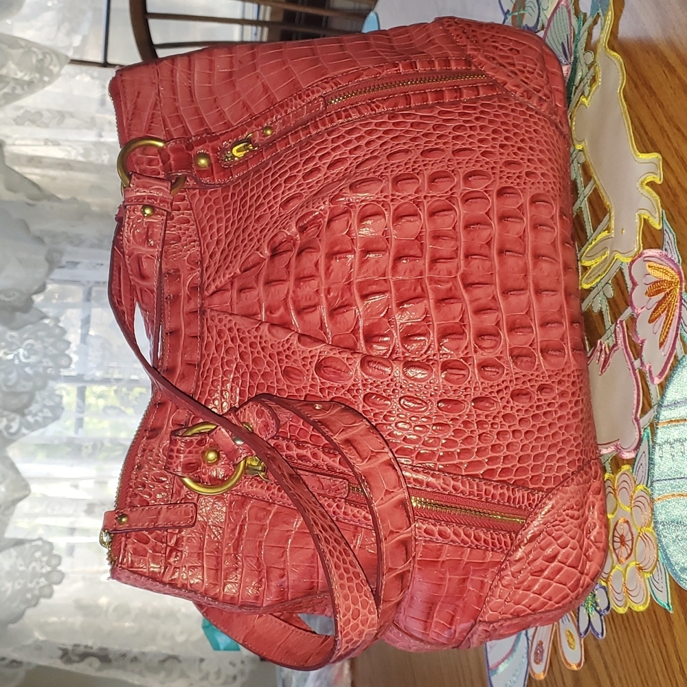 Brahmin Purse. 12x5 height 11. In middle of purse. Straps are 22 long